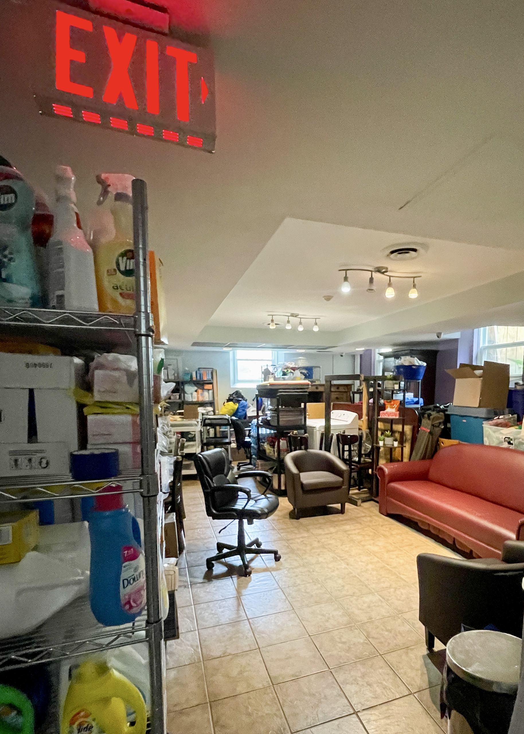 An over stocked back room filled with overflow of furniture, etc. that was salvaged following the flood at St. Joes.